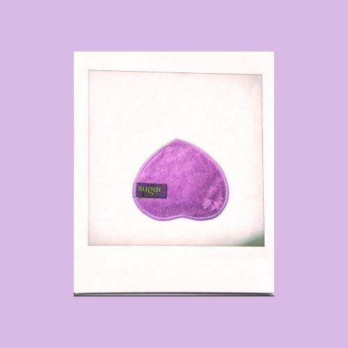 Polaroid of dog nose shaped purple bamboo reusable cleansing wipe.