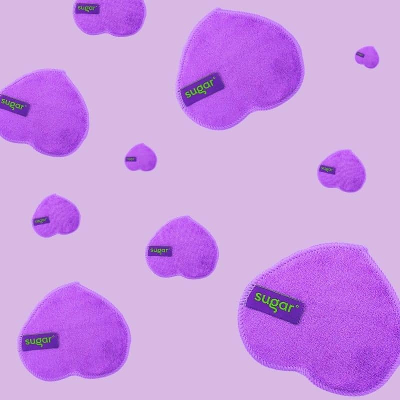 Floating reusable bamboo cleansing wipes by Sugar on a pink background