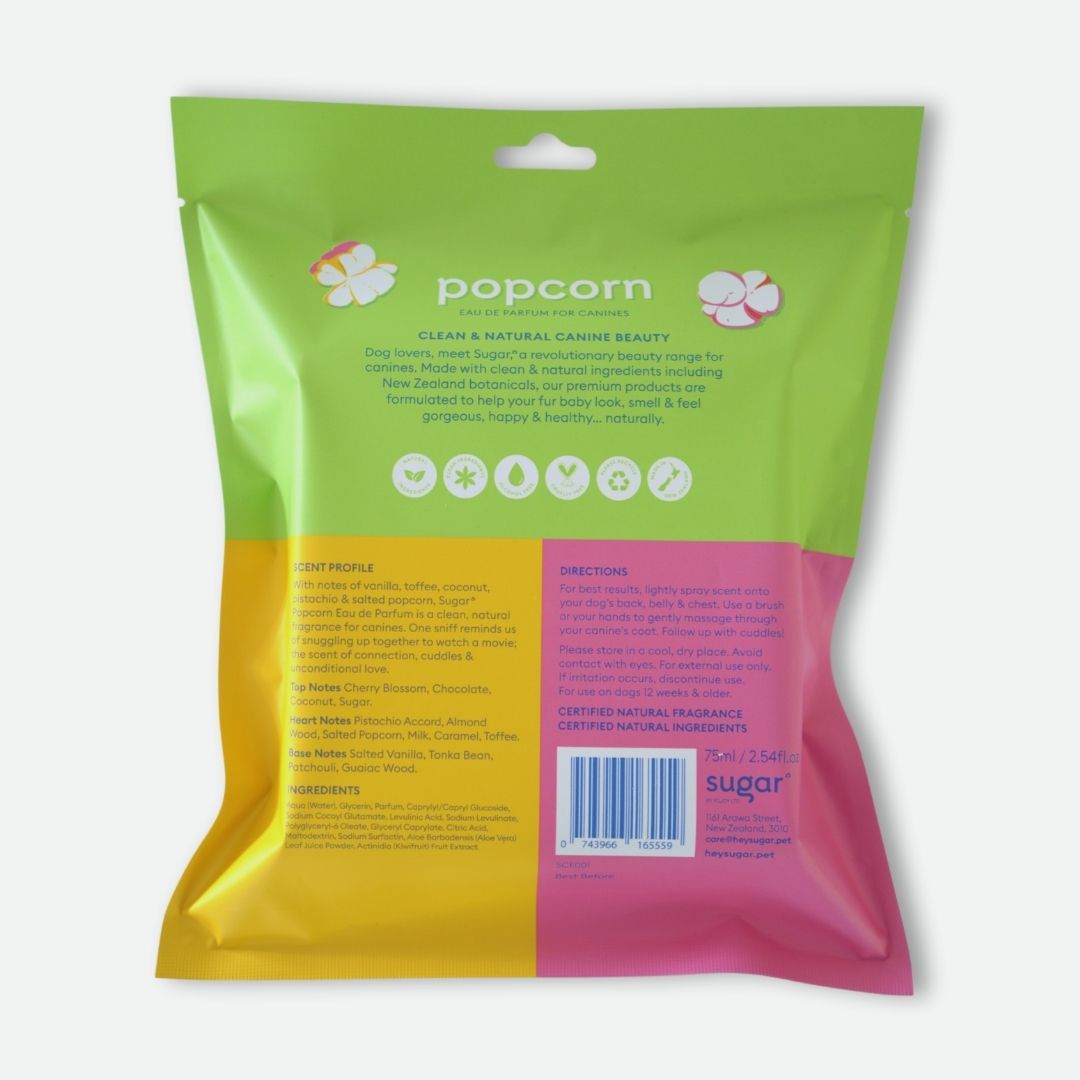 Back of Sugar Popcorn dog perfume packaging with scent profile, brand story, and directions for use