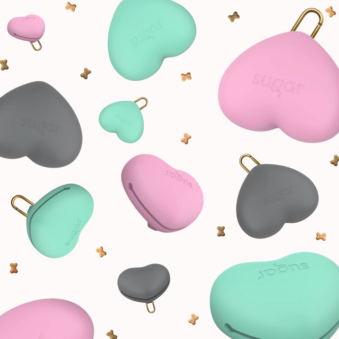 Heart shaped dog silicone treat pouches by Sugar in pink, teal, and black. BPA free clip on